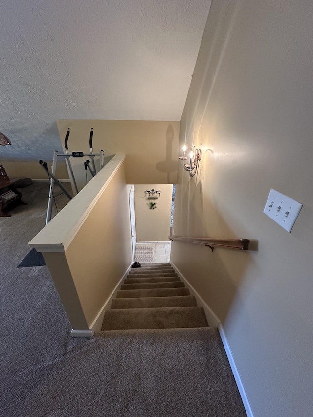 1239 Wentworth Dr, Gallatin, TN 37066 - staircase featuring carpet and a textured ceiling