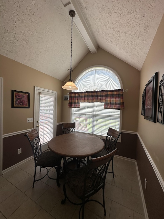 1239 Wentworth Dr, Gallatin, TN 37066 - tiled dining area featuring a textured ceiling and plenty of natural light
