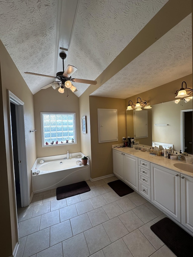 1239 Wentworth Dr, Gallatin, TN 37066 - full bath featuring a textured ceiling, a ceiling fan, double vanity, a garden tub, and tile patterned flooring