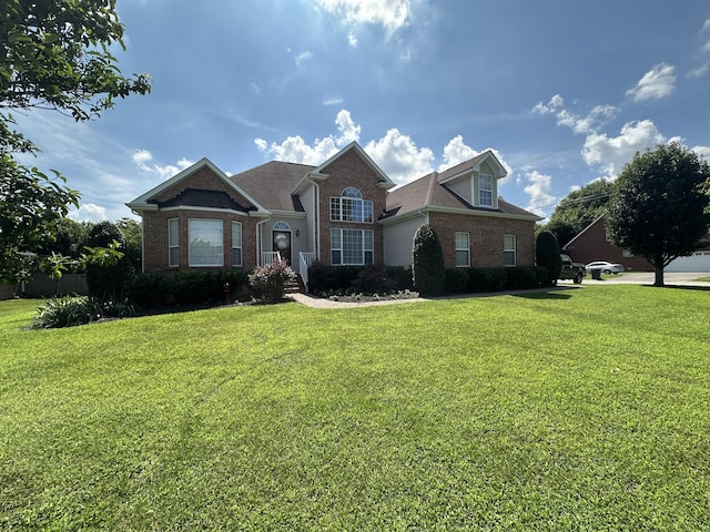 1239 Wentworth Dr, Gallatin, TN 37066 - view of front of home featuring brick siding and a front yard