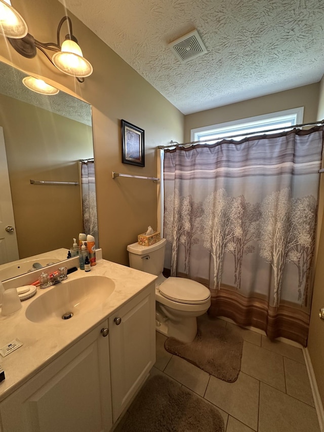 1239 Wentworth Dr, Gallatin, TN 37066 - bathroom featuring vanity, tile patterned flooring, a textured ceiling, and a shower with shower curtain