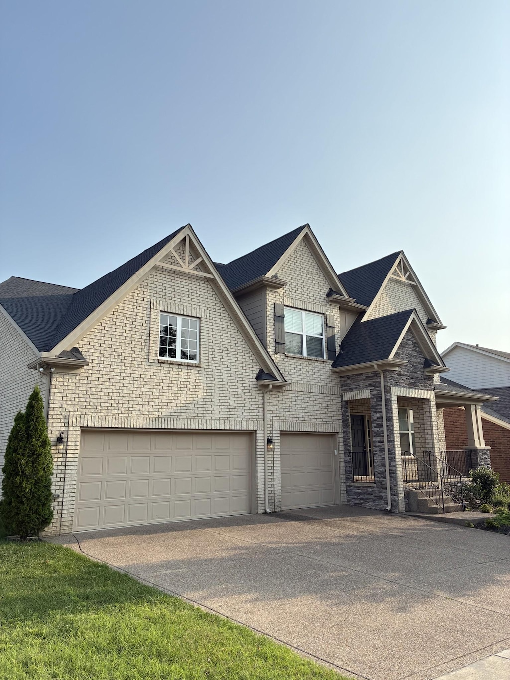 5074 Winslow Dr, Mount Juliet, TN 37122 - view of front facade featuring concrete driveway, a garage, and brick siding