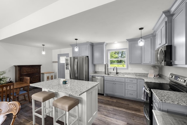 1072 Dugout Rd, Summertown, TN 38483 - kitchen with stainless steel appliances, gray cabinets, dark wood finished floors, and light stone counters