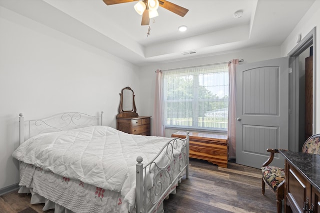 1072 Dugout Rd, Summertown, TN 38483 - bedroom featuring a tray ceiling, dark wood-type flooring, and ceiling fan
