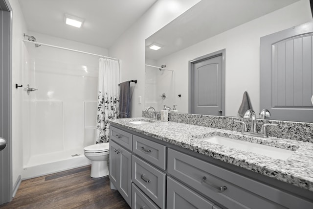 1072 Dugout Rd, Summertown, TN 38483 - bathroom with wood finished floors, double vanity, and a shower with shower curtain