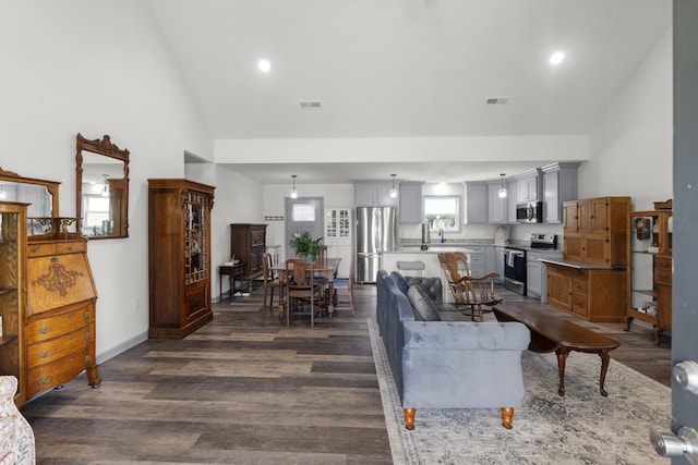 1072 Dugout Rd, Summertown, TN 38483 - living room with dark wood-type flooring, high vaulted ceiling, and recessed lighting