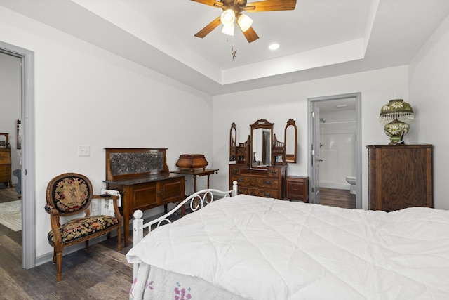 1072 Dugout Rd, Summertown, TN 38483 - bedroom with dark wood finished floors, a raised ceiling, ensuite bath, recessed lighting, and a ceiling fan