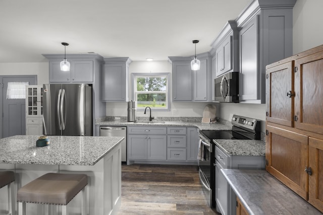 1072 Dugout Rd, Summertown, TN 38483 - kitchen with stainless steel appliances, gray cabinets, dark wood-style flooring, and light stone countertops