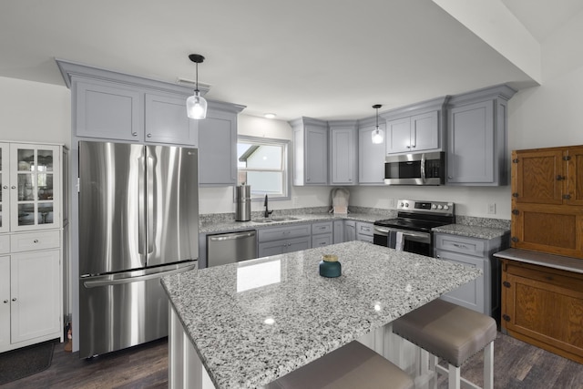 1072 Dugout Rd, Summertown, TN 38483 - kitchen with stainless steel appliances, gray cabinetry, and dark wood finished floors