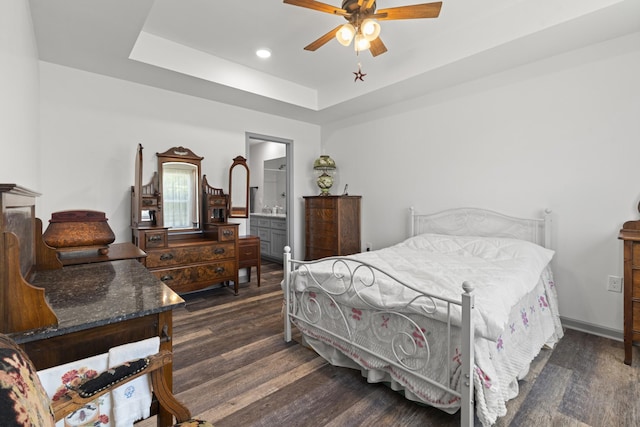 1072 Dugout Rd, Summertown, TN 38483 - bedroom with dark wood-style flooring, a raised ceiling, connected bathroom, ceiling fan, and recessed lighting