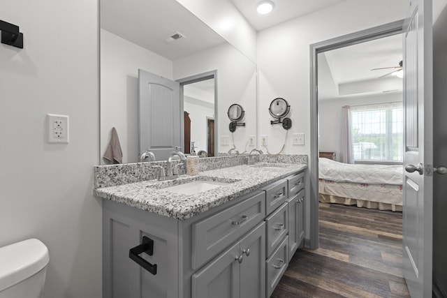 1072 Dugout Rd, Summertown, TN 38483 - bathroom featuring double vanity, wood finished floors, ensuite bathroom, and a ceiling fan