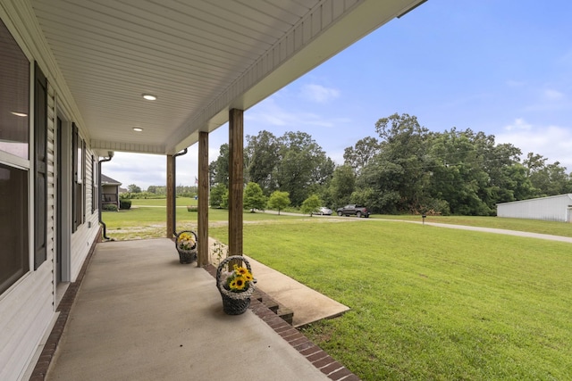 1072 Dugout Rd, Summertown, TN 38483 - covered porch featuring a yard and view of wooded area