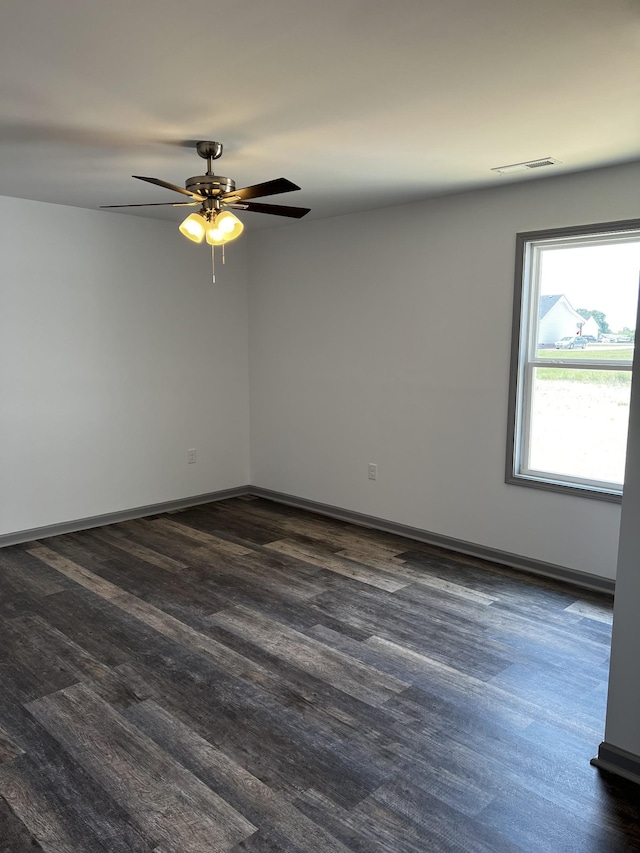 1072 Dugout Rd, Summertown, TN 38483 - spare room with a ceiling fan and dark wood-type flooring