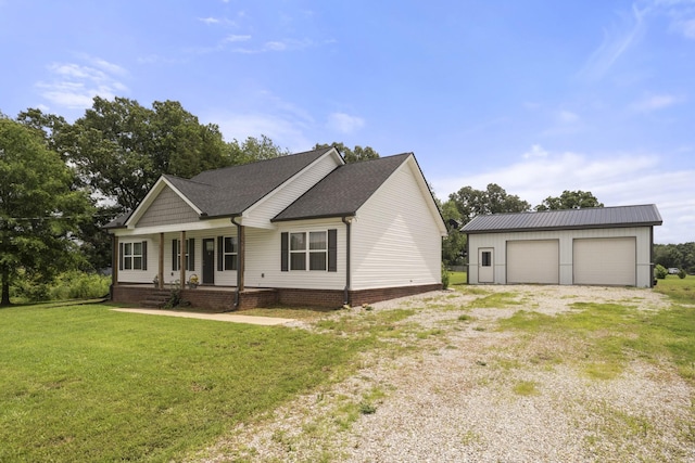 1072 Dugout Rd, Summertown, TN 38483 - view of front of home featuring a porch, a garage, an outbuilding, a front lawn, and roof with shingles