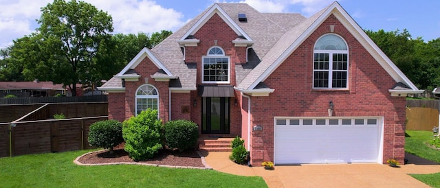6300 Spera Pointe Xing, Hermitage, TN 37076 - traditional-style home featuring brick siding, an attached garage, driveway, and roof with shingles