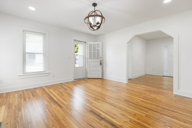 2108 Denham Ave, Columbia, TN 38401 - spare room featuring arched walkways, a chandelier, light wood-style flooring, and recessed lighting