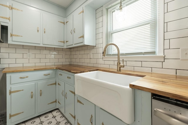 2108 Denham Ave, Columbia, TN 38401 - kitchen with butcher block countertops, white dishwasher, decorative backsplash, and light floors