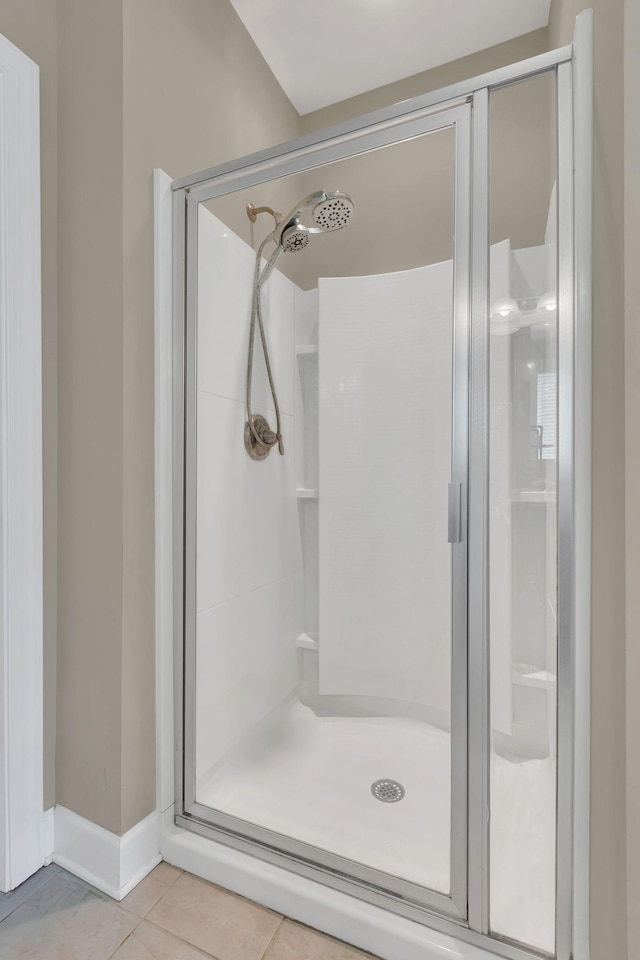 1060 Harvey Springs Dr, Spring Hill, TN 37174 - bathroom featuring a stall shower and tile patterned flooring