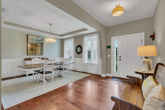 1060 Harvey Springs Dr, Spring Hill, TN 37174 - entryway featuring wood finished floors, wainscoting, a tray ceiling, a chandelier, and a decorative wall