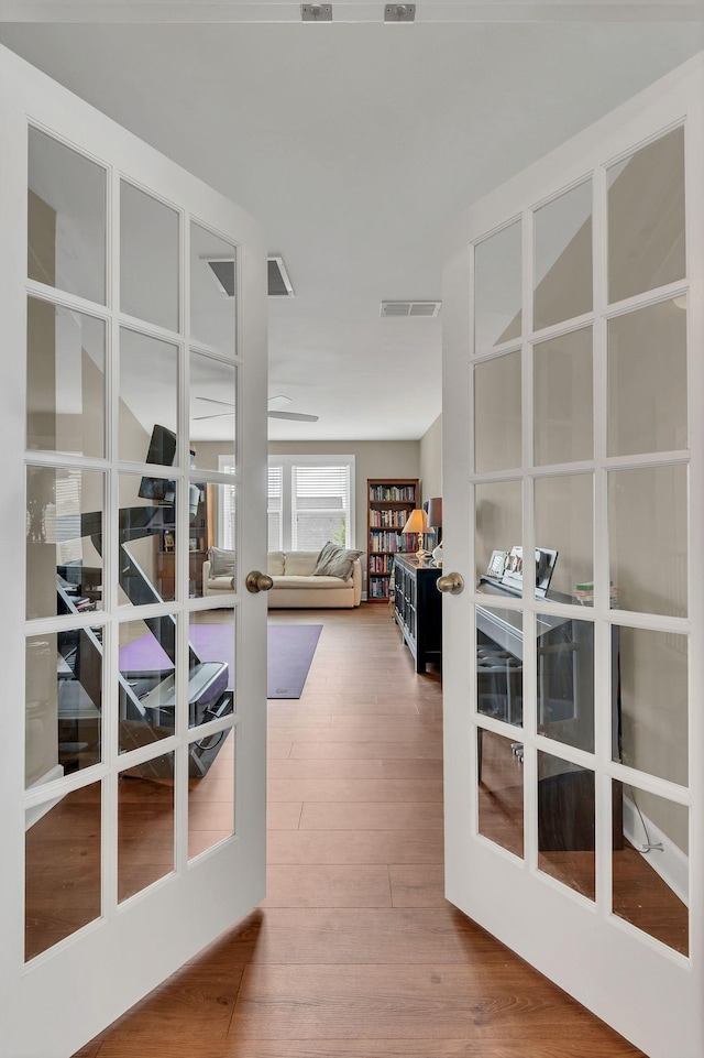1060 Harvey Springs Dr, Spring Hill, TN 37174 - exercise room with french doors and wood finished floors