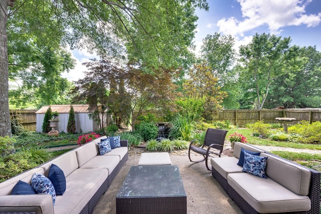 256 Granger View Cir, Franklin, TN 37064 - fenced backyard with an outdoor hangout area, a patio, and view of scattered trees