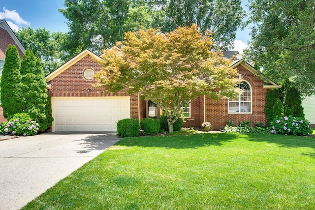 256 Granger View Cir, Franklin, TN 37064 - view of front of home with an attached garage, driveway, a front lawn, and brick siding
