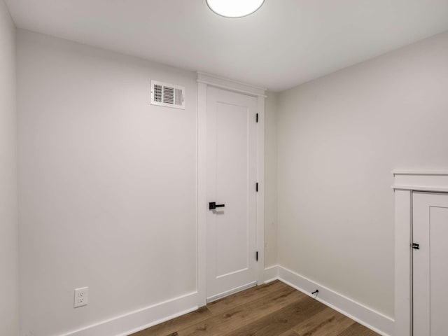 1015 Jump Off Rd, Bon Aqua, TN 37025 - laundry room featuring dark wood finished floors and baseboards