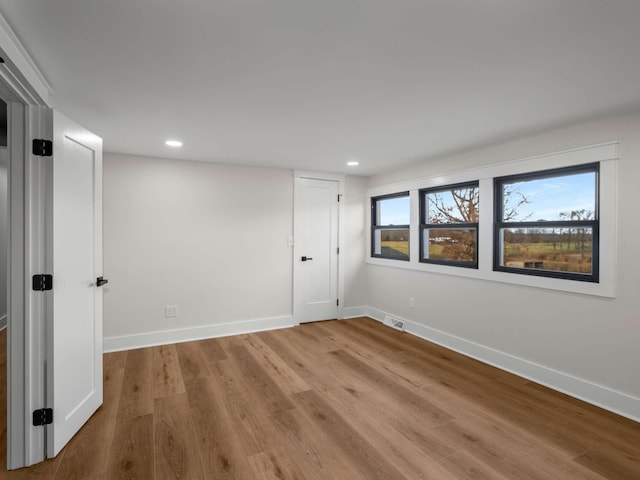 1015 Jump Off Rd, Bon Aqua, TN 37025 - empty room featuring wood finished floors and recessed lighting