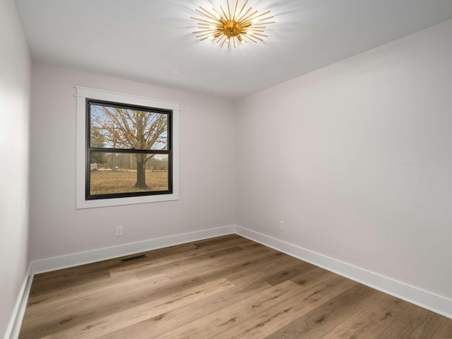 1015 Jump Off Rd, Bon Aqua, TN 37025 - spare room with baseboards and wood finished floors