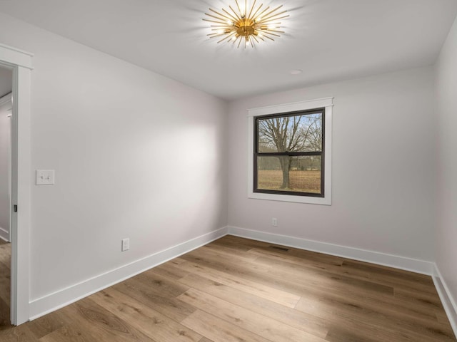 1015 Jump Off Rd, Bon Aqua, TN 37025 - unfurnished room with baseboards and wood finished floors