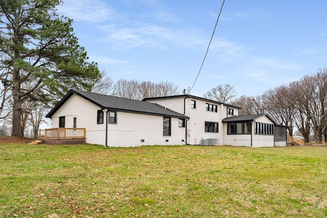 1015 Jump Off Rd, Bon Aqua, TN 37025 - back of property with a deck, a sunroom, and a yard