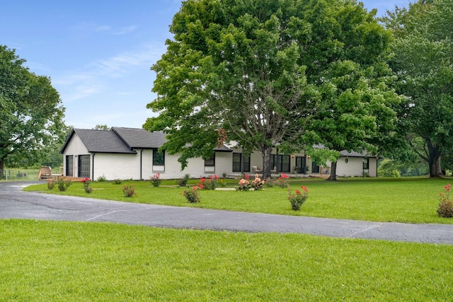 1015 Jump Off Rd, Bon Aqua, TN 37025 - view of front facade with a front yard