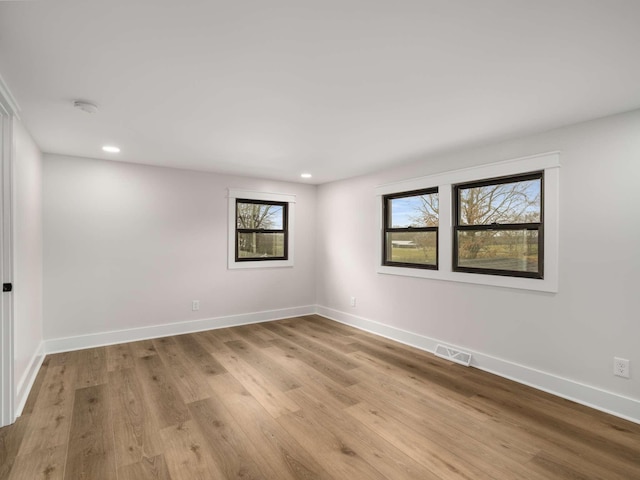 1015 Jump Off Rd, Bon Aqua, TN 37025 - empty room featuring recessed lighting, wood finished floors, and a smoke detector