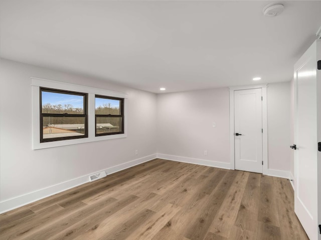 1015 Jump Off Rd, Bon Aqua, TN 37025 - empty room featuring recessed lighting, a smoke detector, and wood finished floors