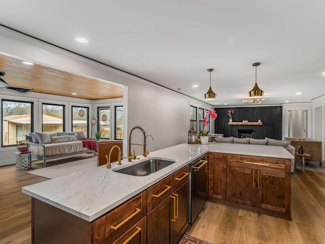 1015 Jump Off Rd, Bon Aqua, TN 37025 - kitchen featuring open floor plan, dishwasher, light stone countertops, light wood-style floors, and recessed lighting
