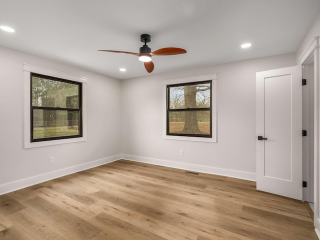 1015 Jump Off Rd, Bon Aqua, TN 37025 - empty room with a ceiling fan, light wood finished floors, and recessed lighting