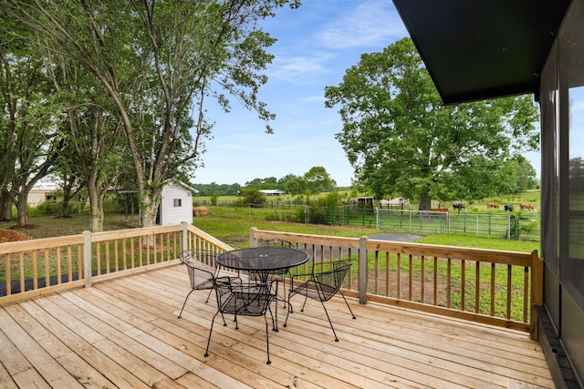 1015 Jump Off Rd, Bon Aqua, TN 37025 - wooden deck featuring outdoor dining space, a shed, and a fenced backyard