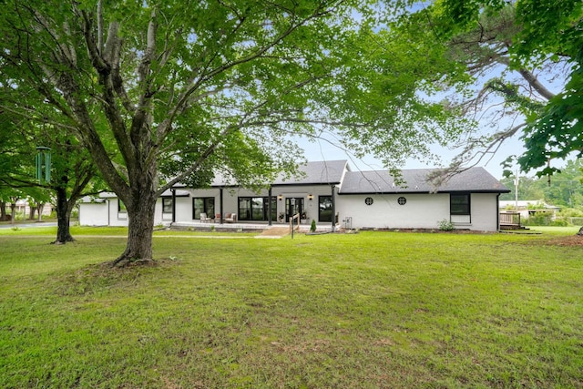 1015 Jump Off Rd, Bon Aqua, TN 37025 - back of property featuring a lawn and roof with shingles
