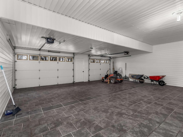 1015 Jump Off Rd, Bon Aqua, TN 37025 - garage featuring a garage door opener