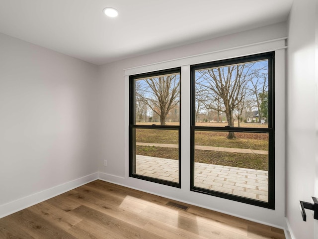 1015 Jump Off Rd, Bon Aqua, TN 37025 - unfurnished room featuring wood finished floors and recessed lighting