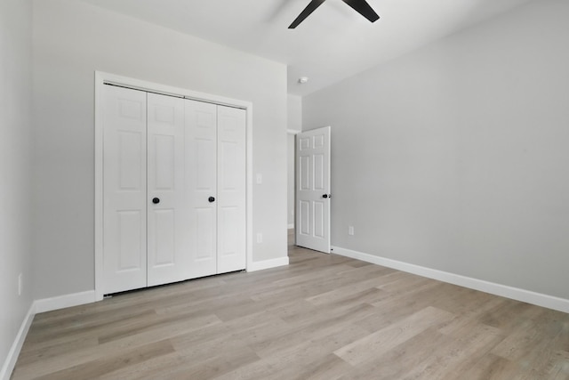 217 Dunnaway St, Shelbyville, TN 37160 - unfurnished bedroom with light wood-style flooring, a closet, and a ceiling fan