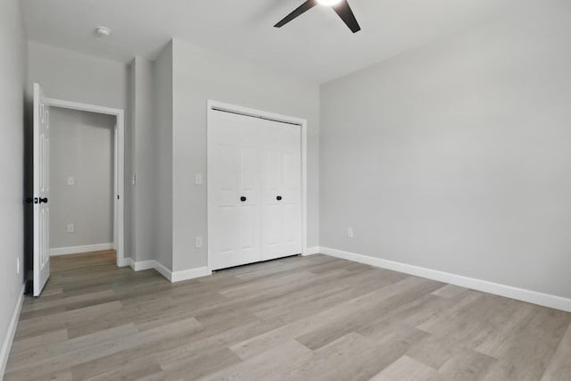 217 Dunnaway St, Shelbyville, TN 37160 - unfurnished bedroom with light wood finished floors, a closet, and a ceiling fan