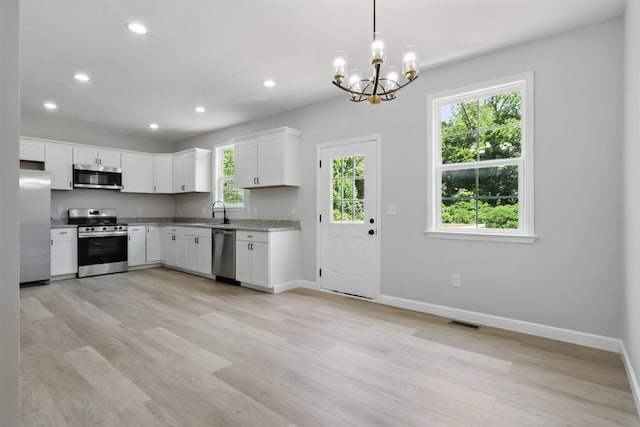 217 Dunnaway St, Shelbyville, TN 37160 - kitchen featuring appliances with stainless steel finishes, plenty of natural light, a chandelier, light wood-type flooring, and recessed lighting
