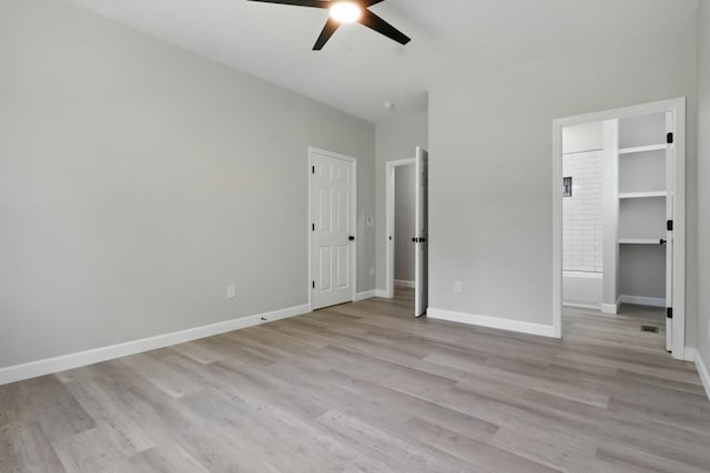 217 Dunnaway St, Shelbyville, TN 37160 - unfurnished bedroom with light wood-style floors and a ceiling fan