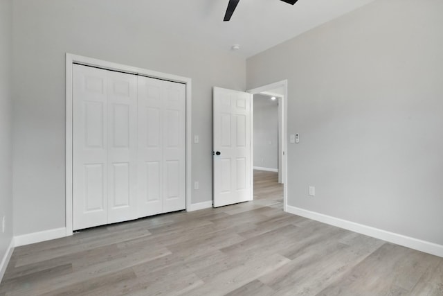 217 Dunnaway St, Shelbyville, TN 37160 - unfurnished bedroom featuring light wood-style flooring, a closet, and ceiling fan