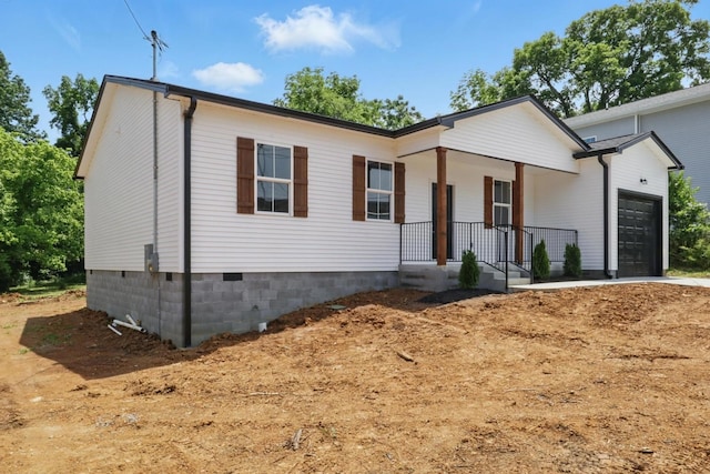 219 Dunnaway St, Shelbyville, TN 37160 - view of front of home with an attached garage, a porch, and driveway
