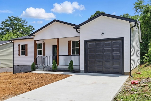 219 Dunnaway St, Shelbyville, TN 37160 - view of front facade featuring a porch, an attached garage, and driveway