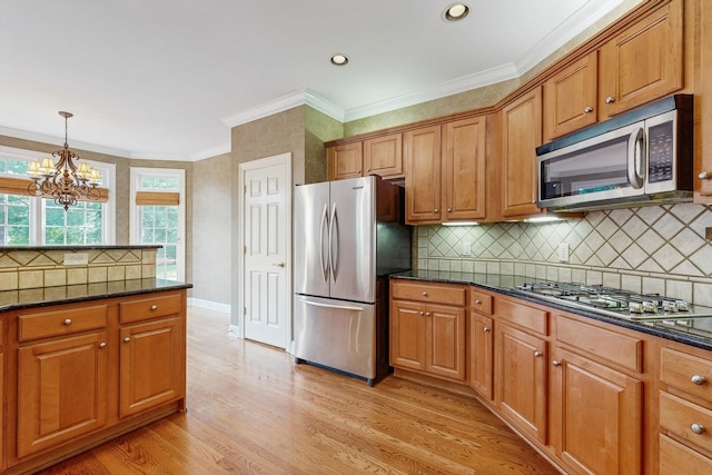 915 Joel Cheek Blvd, Franklin, TN 37064 - kitchen with appliances with stainless steel finishes, brown cabinets, light wood-style flooring, crown molding, and recessed lighting