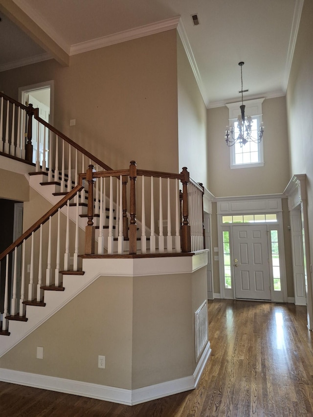915 Joel Cheek Blvd, Franklin, TN 37064 - foyer with wood finished floors, a chandelier, stairway, a high ceiling, and ornamental molding