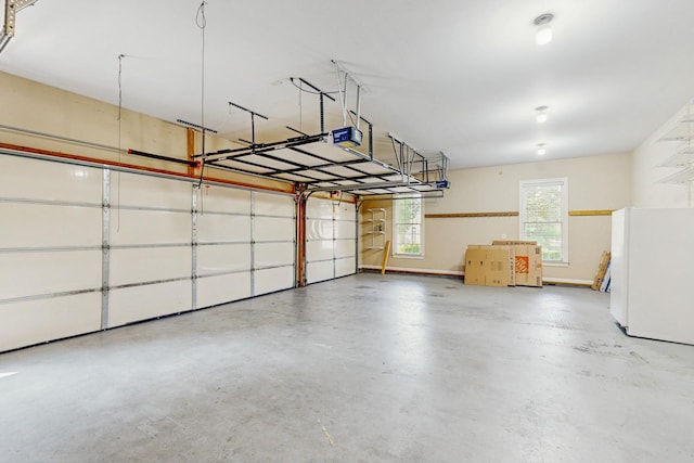915 Joel Cheek Blvd, Franklin, TN 37064 - garage with freestanding refrigerator and a garage door opener